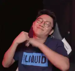 Team Liquid member crosses arms and smiles