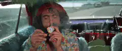 Jerry Garcia smoking a pipe in a car