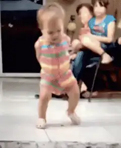 Baby dancing in rainbow outfit