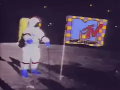Astronaut planting MTV flag on the moon
