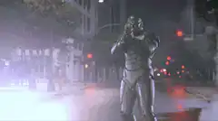 RoboCop destroys a truck with his arm cannon