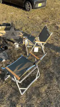 Shirtless man dancing at campsite