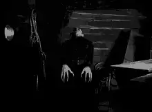 Nosferatu rising from coffin