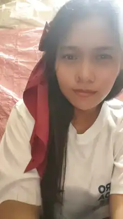 Girl with red ribbon in hair