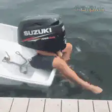 Person with Suzuki motor on head