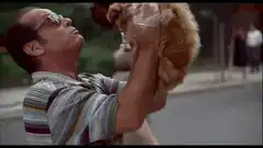 Jack Nicholson holding a dog in a plastic bag