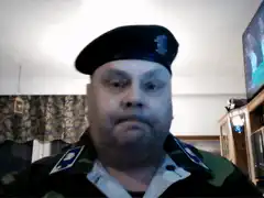 man in military uniform saluting
