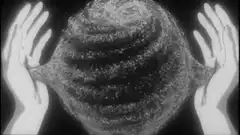 Hands holding a textured sphere
