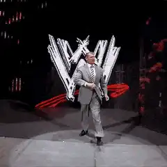 Vince McMahon running in suit