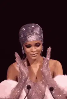 Rihanna clapping in sparkly outfit