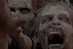 Zombie reaching out with clawed hand