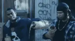 Two men holding bread and soda
