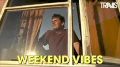 Man looking out window weekend vibes