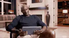 Michael Jordan laughing at tablet