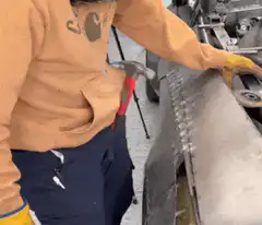 Welder accidentally hits hammer with welding torch