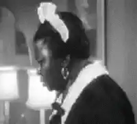 African American woman turns head with wide eyes