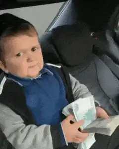 Baby counting money in car seat