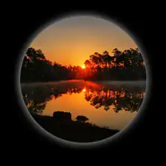 sunset reflection in circular frame