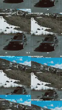 Nissan Frontier driving on snowy mountain road