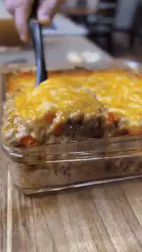 Serving cheesy meatloaf casserole