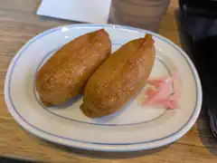 Two fried croquettes on a plate