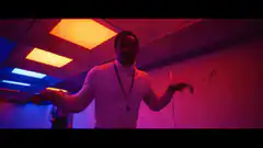 Man shrugging in colorful room