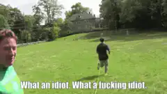Man in green shirt laughs at idiot