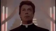 Father Frank looking up and smiling