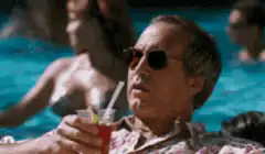 Don Corleone sipping a drink by the pool
