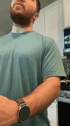 Man with blue face paint in kitchen