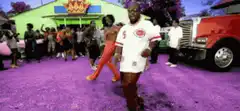 Two men dancing on purple ground