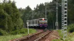 Train approaching and people dancing inside