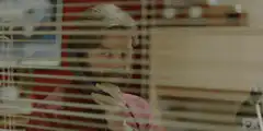 Nucky Thompson eavesdropping through blinds