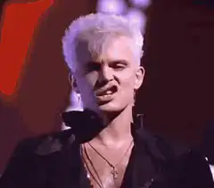 Boy George singing passionately