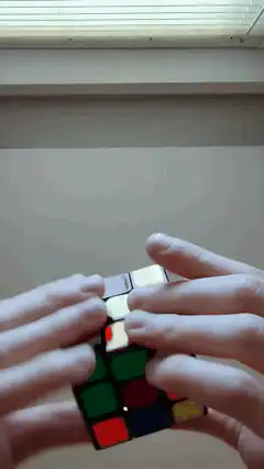 Hands solving a Rubik's cube