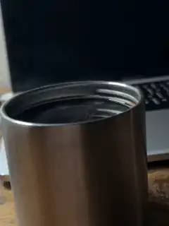 steaming metal travel mug