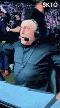 Bald man in headset screaming excitedly