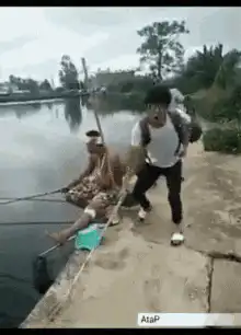 Man fishing falls into water