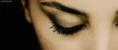 Woman opens green eye