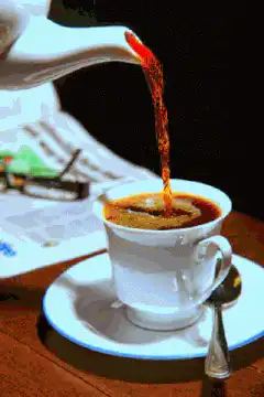 Coffee being poured into a cup