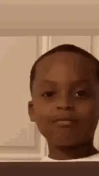 Kid looking at camera with a smirk