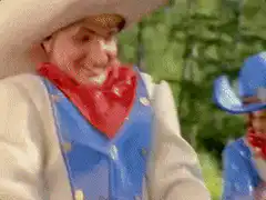 Man on mechanical horse falls off