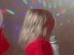 Toddler singing with microphone