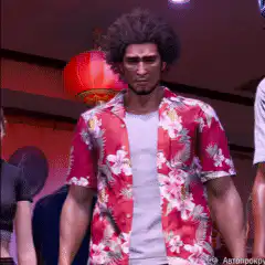 Kazuma Kiryu stretches in Hawaiian shirt