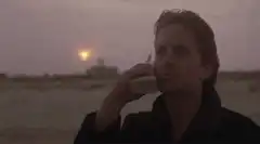 Michael Douglas talking on a cell phone at sunset