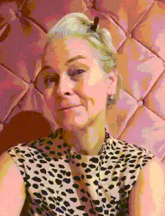 Woman in leopard print purses lips