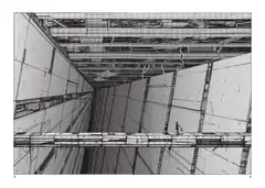 Tiny figure on massive industrial beam