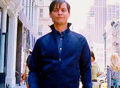 Tobey Maguire walking and nodding
