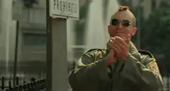 Officer clapping sarcastically