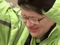 Man in green jacket crying and screaming